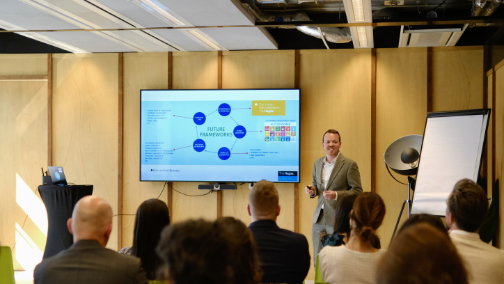 Image of Stuart Payne giving a presentation about Legal and Policy in The Hague