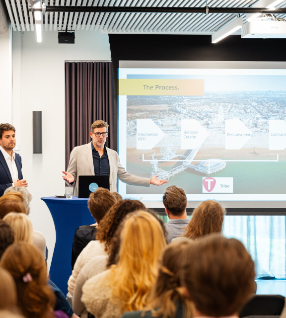 Two men presenting a project for The Hague