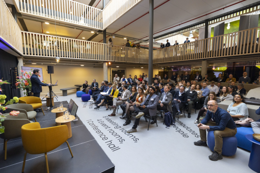 People listening to a presentation at Titaan