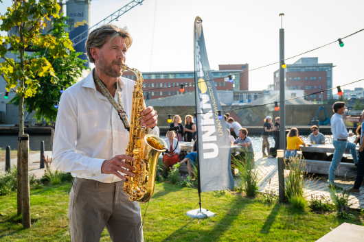 Playing Saxophone outside Titaan