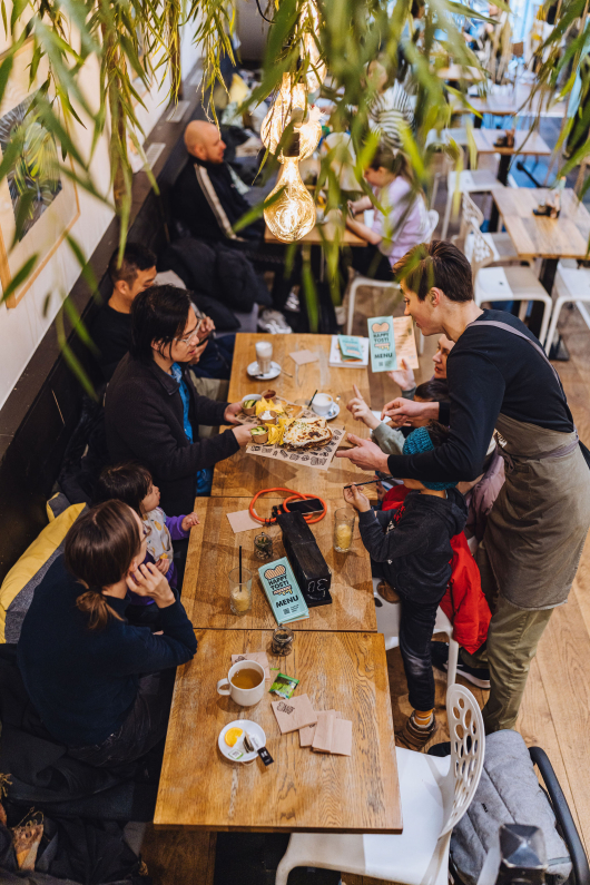 A group of people enjoying their time together in a café.