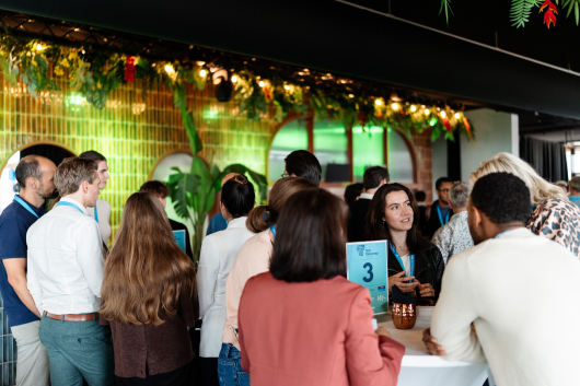 Group of people engaged in conversation at networking event
