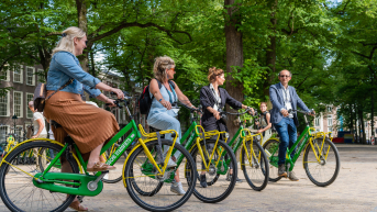 Four event participants Cycling through The Hague