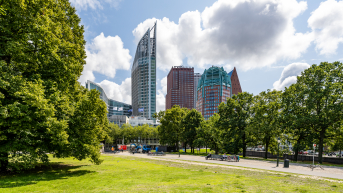 Image of the skyline of The Hague with a green park