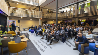 People listening to a presentation at Titaan