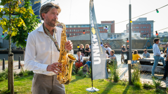 Playing Saxophone outside Titaan
