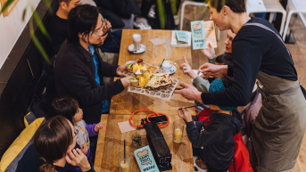 A group of people enjoying their time together in a café.