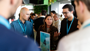 Group of people talking at a networking event