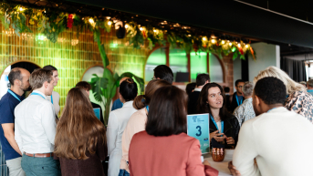 Group of people engaged in conversation at networking event