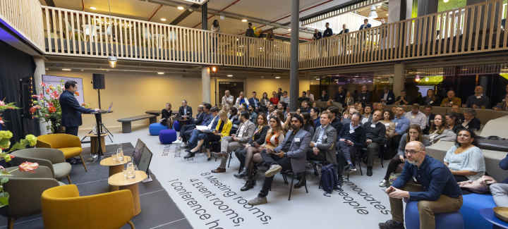 People listening to a presentation at Titaan