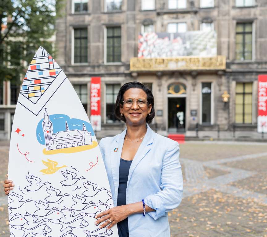 Advisor Jeanine with Surfboard