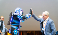 robot and man in suit doing a high five