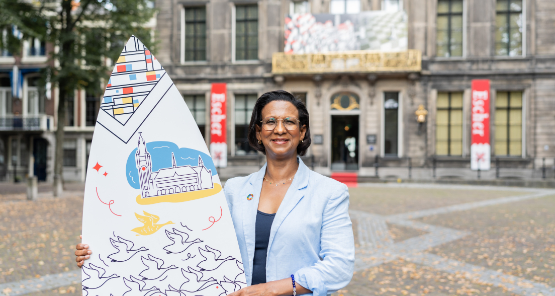 Advisor Jeanine with Surfboard