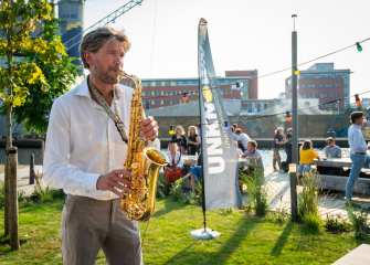 Playing Saxophone outside Titaan