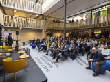 People listening to a presentation at Titaan