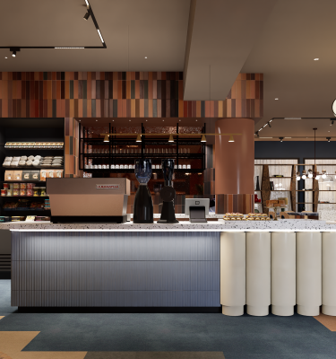 A modern coffee shop with colorful walls and a long counter.