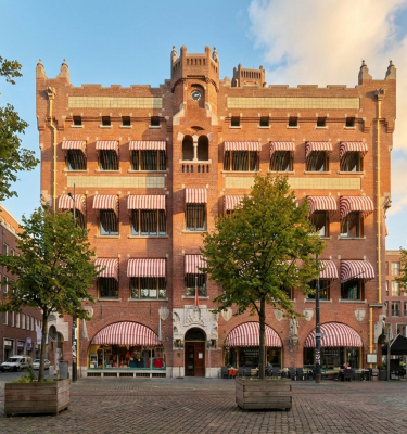 Historic building with awnings and trees in The Hague