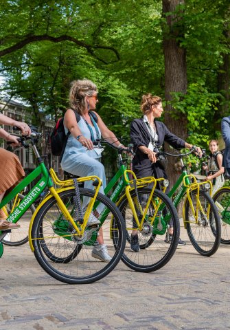 Four event participants Cycling through The Hague