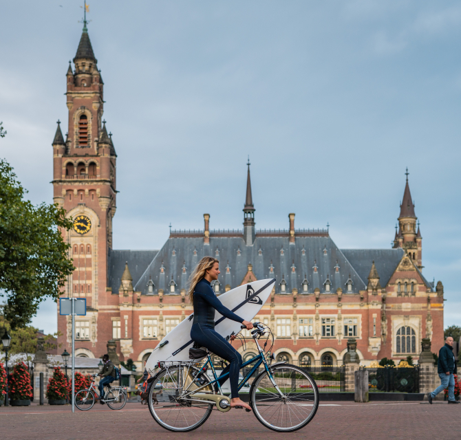 Surfer with Peace Palace in The Hague