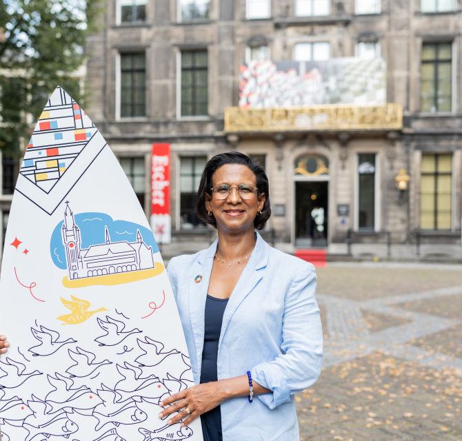 Advisor Jeanine with Surfboard