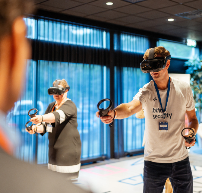 Image two people with VR glasses playing VR game.