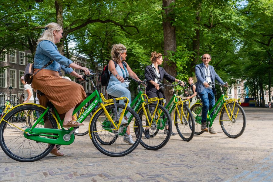 Four event participants Cycling through The Hague