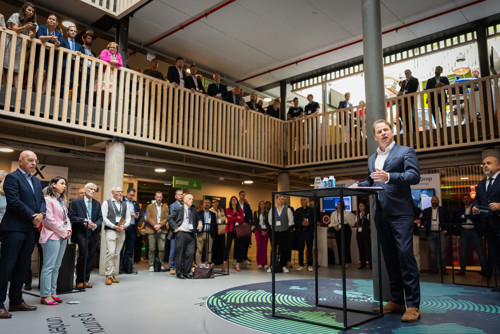 A speaker presents during a networking event in The Hague.