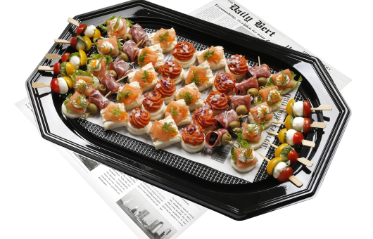 A platter featuring assorted appetizers like canapés and skewers.