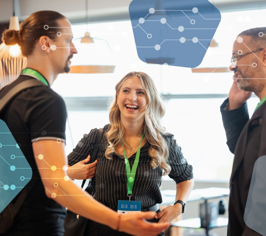 Three people engaged in a business conversation.