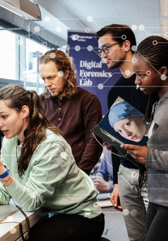 Students collaborating in the Digital Forensics Lab.