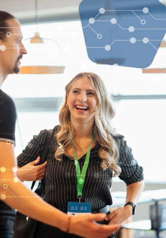Three people engaged in a business conversation.
