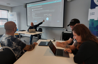 Group of people attending a cybersecurity presentation.