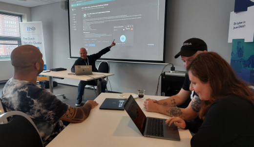 Group of people attending a cybersecurity presentation.