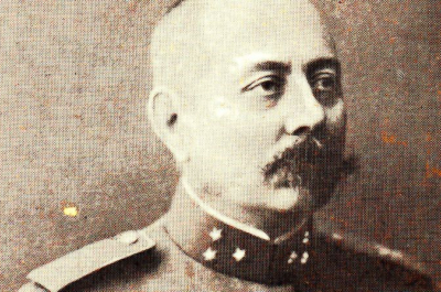 Portrait of Major Lodewijk Willem Johan Karel Thomson, commander of the Dutch military mission. He is shown in sepia tone, wearing a decorated military uniform with epaulets and a high collar, and has a prominent mustache. He gazes to the left in this historical photograph.