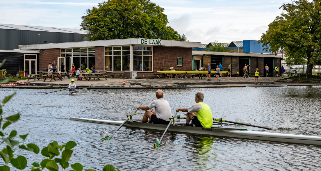 People rowing on the water at Rowing Club De Laak.