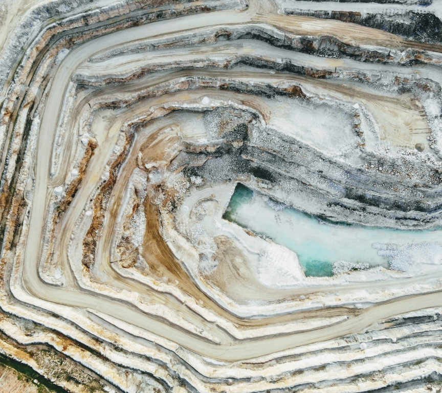Aerial view of a mining landscape with water pools.