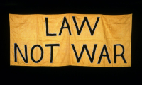 Law not War. Suffrage banner by LSE Library on Unsplash