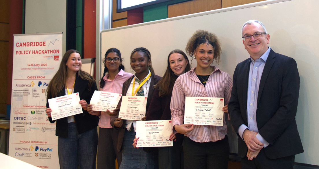 Six participants pose with certificates after the Cambridge Policy Hackathon.