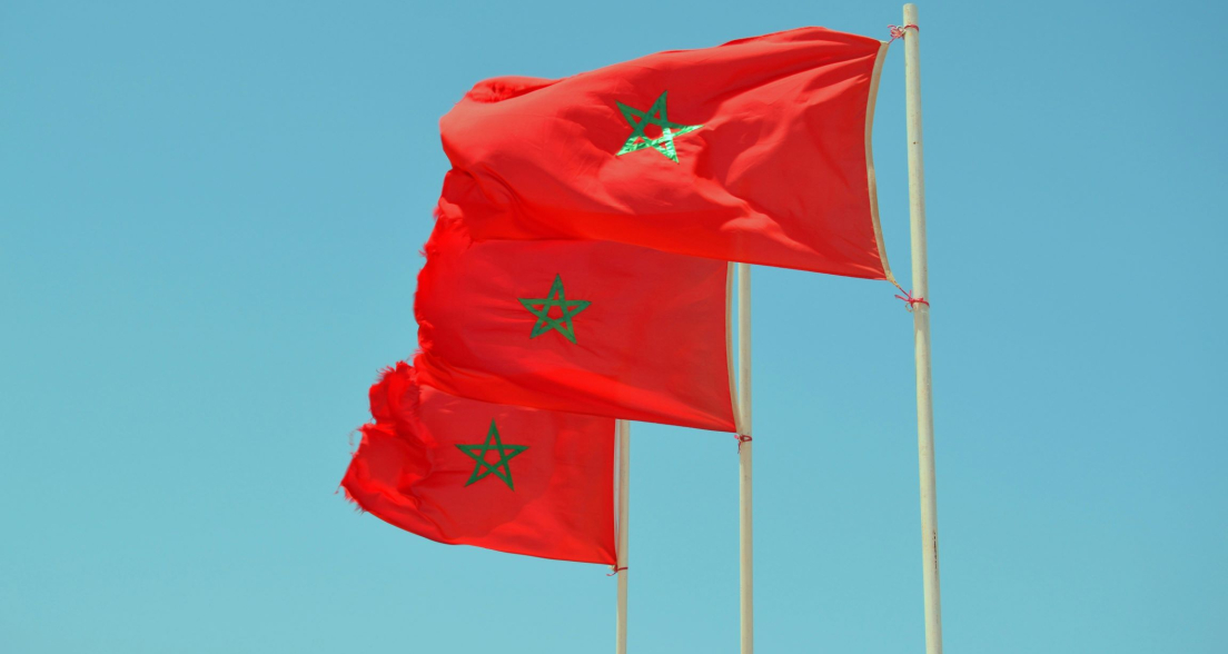 Picture of Afker Moiz via Unspash moroccan flags and a blue sky