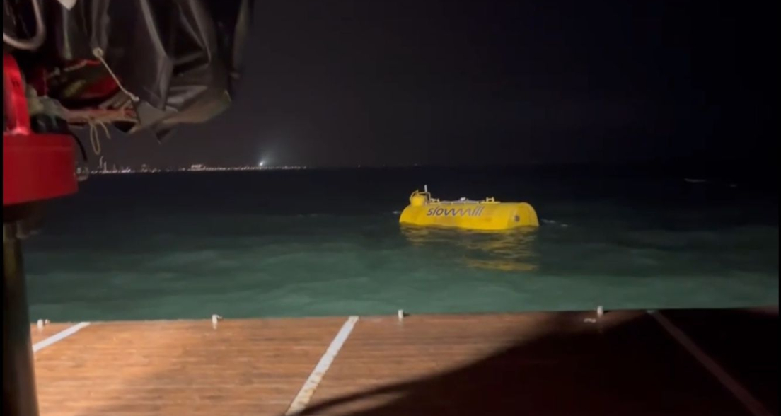 SlowMill golf energy generator at night in the water of Scheveningen