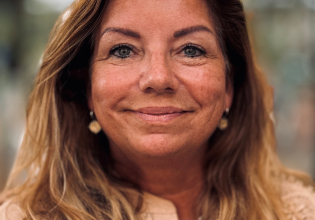 Portrait of a woman smiling with brown hair