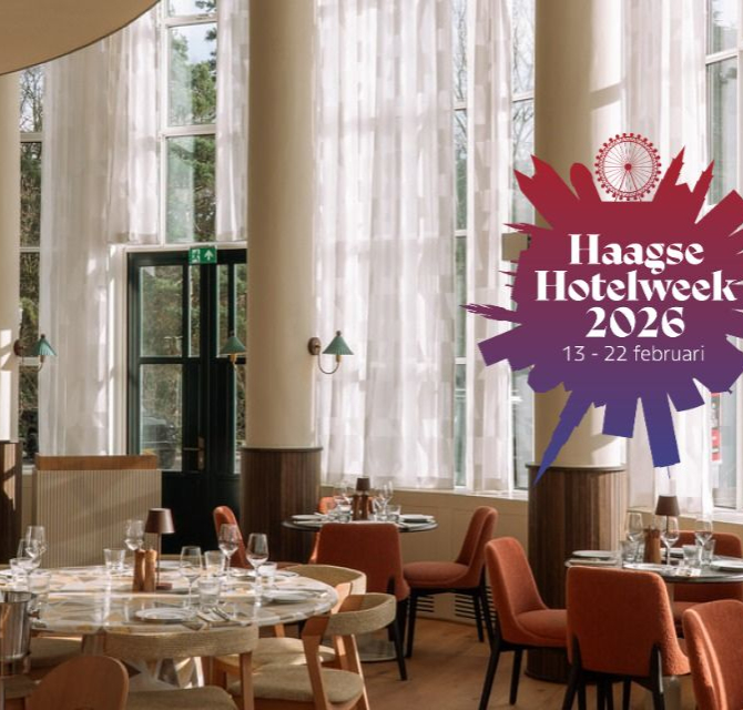 Interior of a modern dining room with round table and chairs, lighting, and large windows.