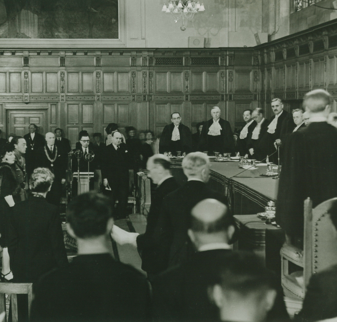 Judges and audience in a formal courtroom