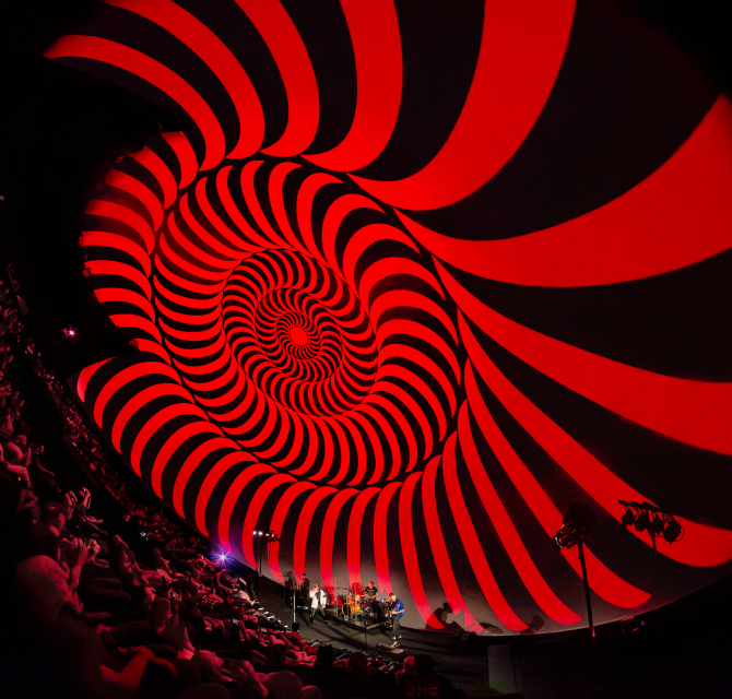 Hypnotic rotating pattern in red and black