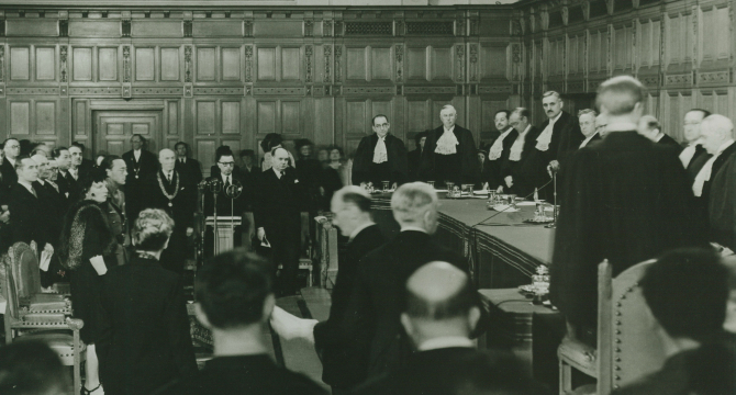 Judges and audience in a formal courtroom