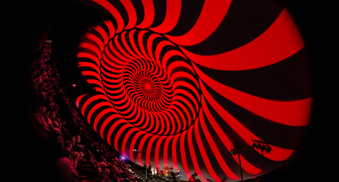 Hypnotic rotating pattern in red and black