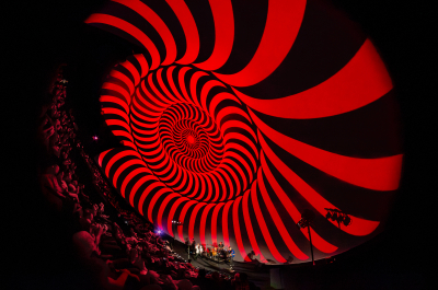 Hypnotic rotating pattern in red and black
