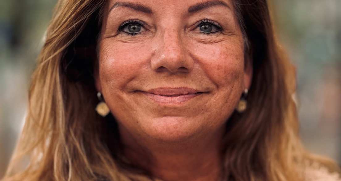 Portrait of a woman smiling with brown hair